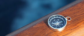 Compass on a wooden table