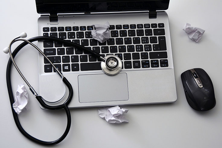 A stethoscope and a laptop