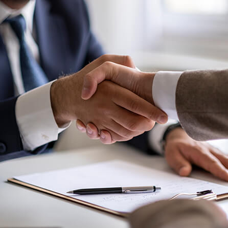 Advisor shaking hands with a client