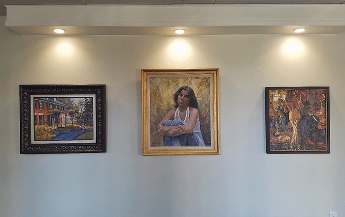 paintings hanging on a wall