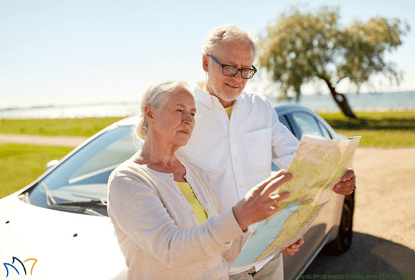 Senior Couple Reading Road Map SM IMprint and logo