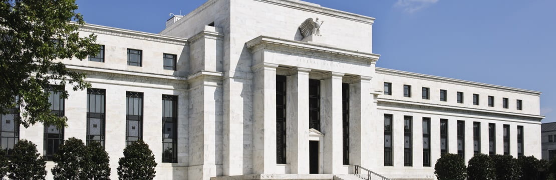 Federal Reserve sits at an angle with a tree appearing in the left-hand corner