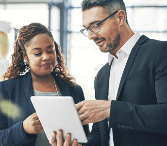 two advisors talking with an ipad